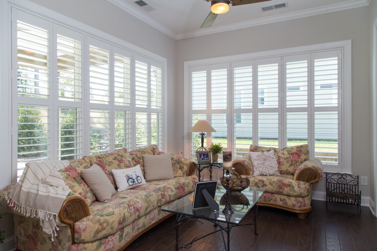 Traditional sunroom with interior shutters in Boston.
